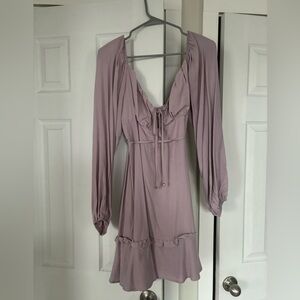 Magenta sun dress with ties and ruffles, perfect for a summer outing